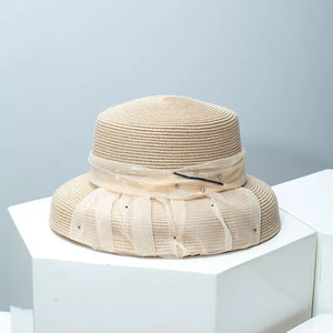 Beige wheat straw cloche hat with ribbon and rhinestone detail