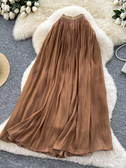 Brown pleated maxi skirt with a flowy, elegant cut.