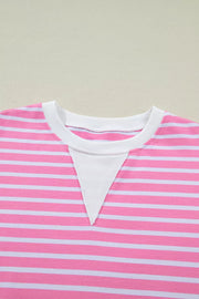 Pink and white striped cotton t-shirt with round neck and white inset detail.