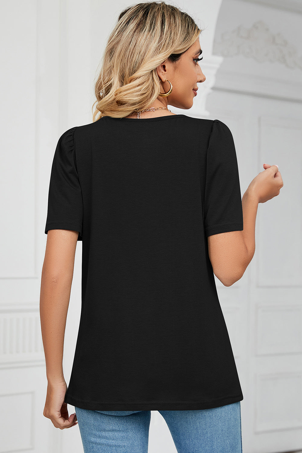 Black tee with square neck and sculpted short sleeves.