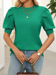 Green knit sweater with mock neck and puff sleeves