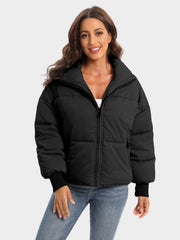Black padded bomber jacket with ribbed cuffs and a high collar.