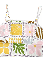 Vibrant floral print cami dress with adjustable straps and square neckline.