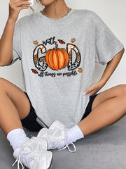 Grey graphic t-shirt with pumpkin and leopard print "GOD" text and butterflies.