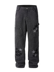 Dark embroidered star carpenter jeans with checkered pattern details.
