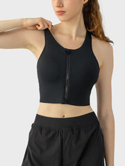Black zip-front racerback sports bra with a cropped fit
