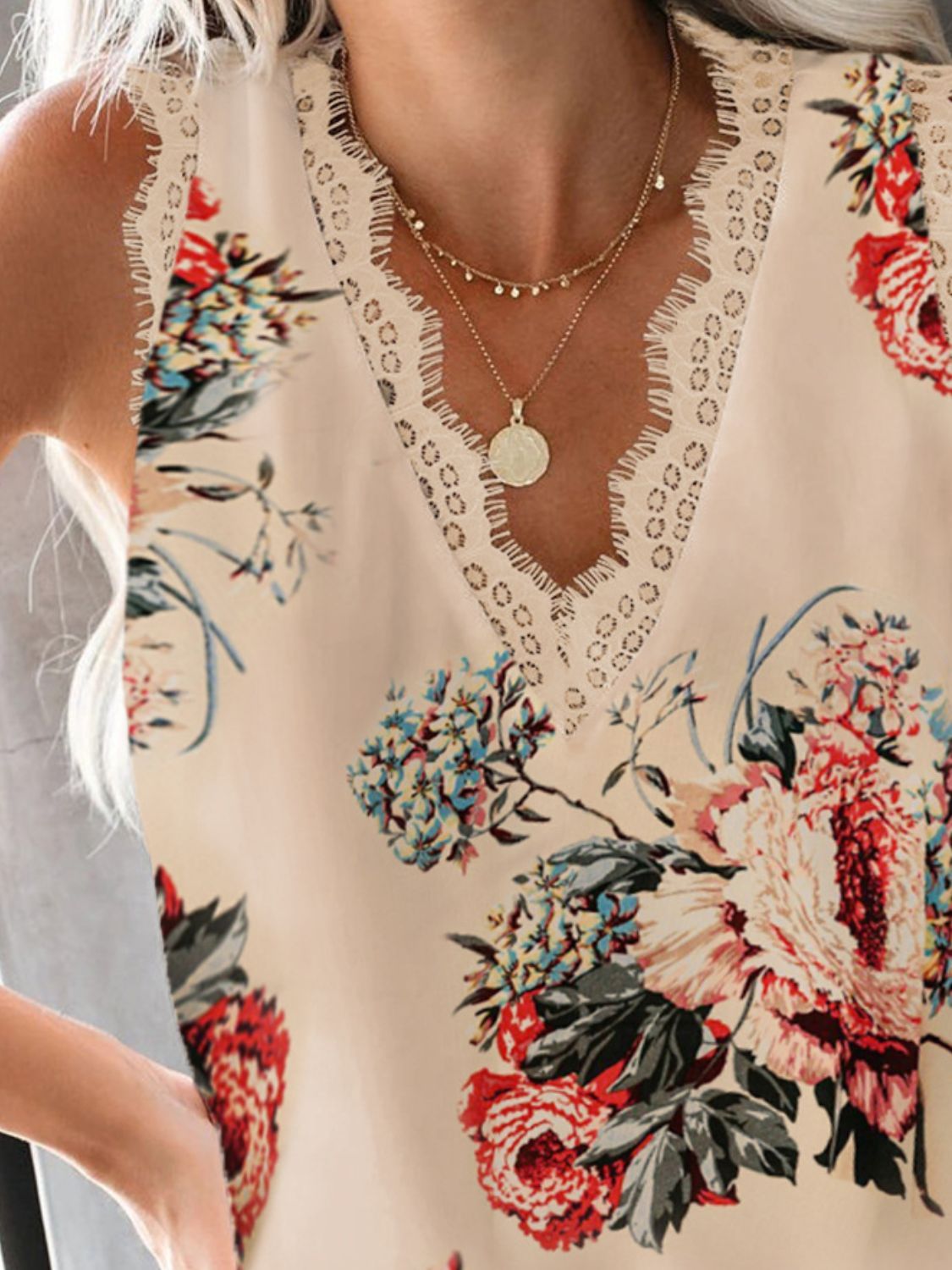 Floral print camisole with lace trim neckline and V-neck.