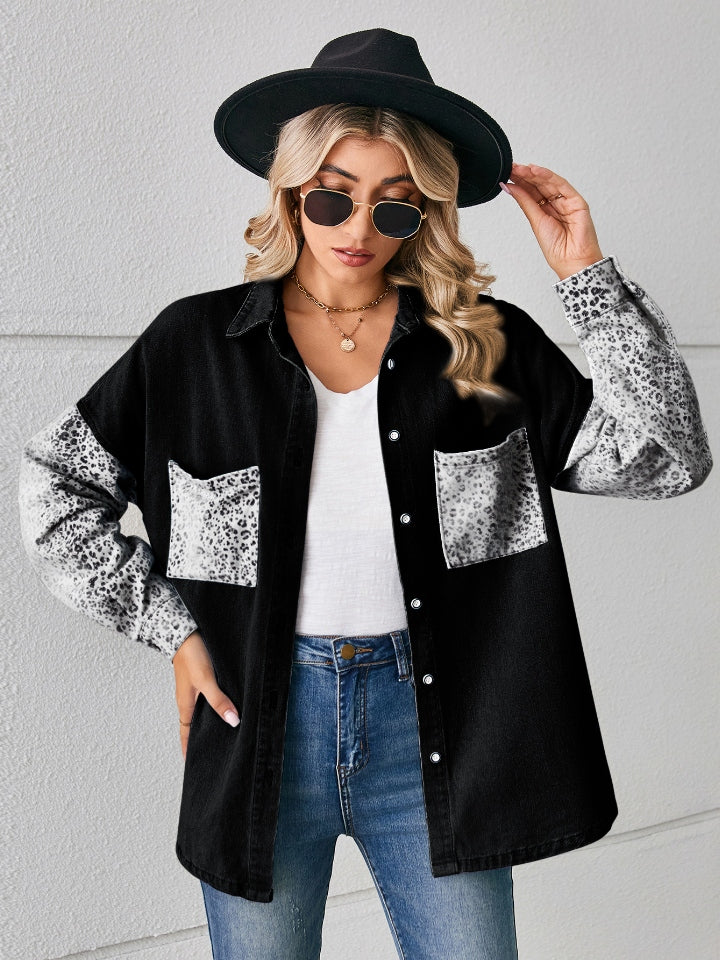 Black denim overshirt with leopard print sleeves and pockets, button front, collared.