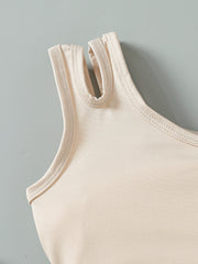 Baby tank top with asymmetrical neckline detail in beige cotton.
