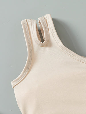 Baby tank top with asymmetrical neckline detail in beige cotton.