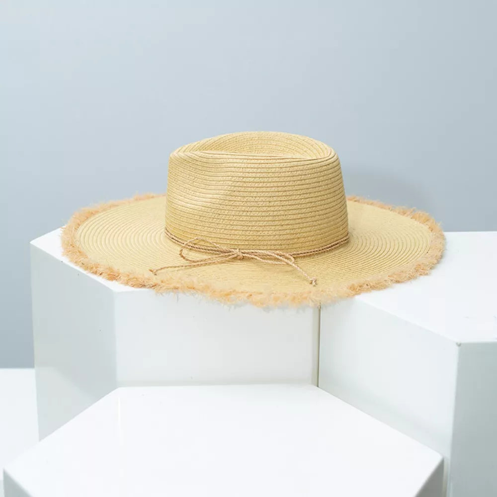 Beige straw sun hat with frayed brim and tie detail