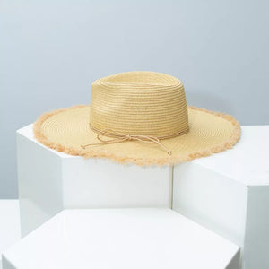 Beige straw sun hat with frayed brim and tie detail
