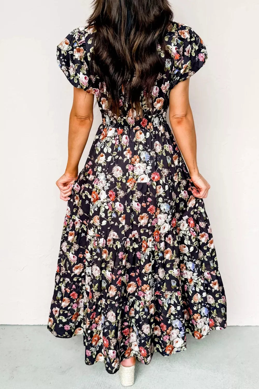 Floral tiered maxi dress with smocked waist and short sleeves.