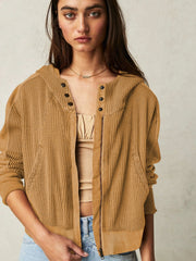 Camel waffle knit cropped hoodie with snap-front detail and zipper closure.
