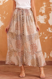Patchwork floral maxi skirt with adjustable tie waist and button front.
