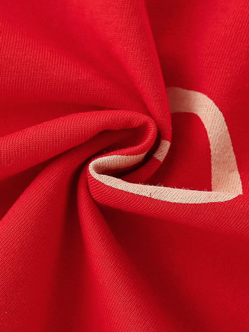 Red cotton t-shirt for kids with a cream heart detail and trim.