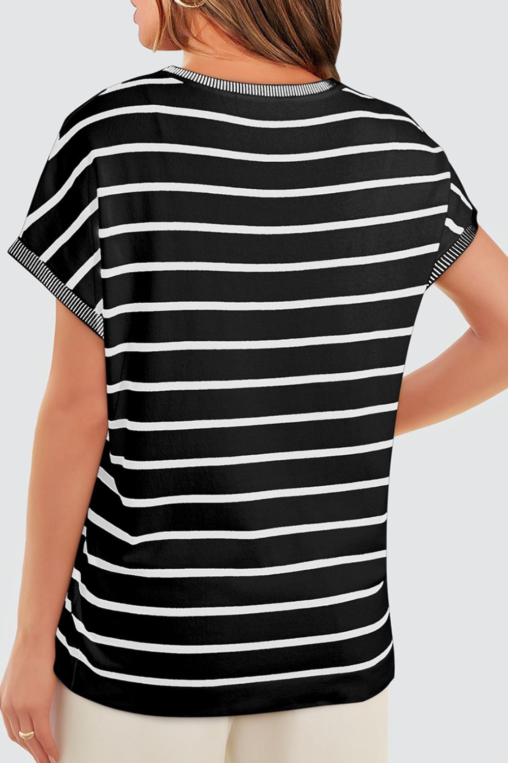 Black and white striped boxy tee with contrast ribbed trim on neckline and sleeves.