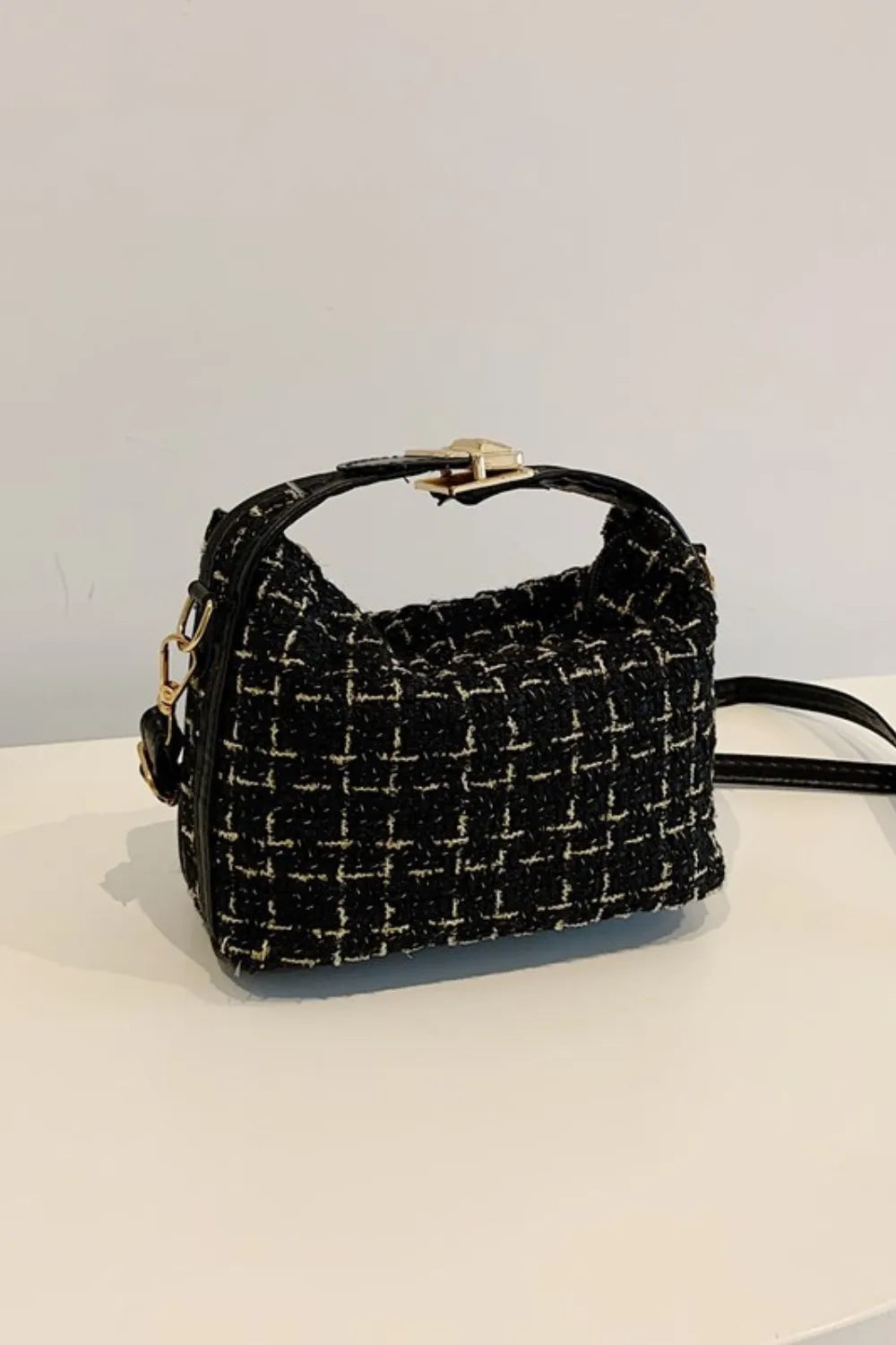 Black tweed box bag with gold clasp and detachable strap