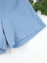 Light blue textured cotton bermuda shorts with a casual, breathable cut.