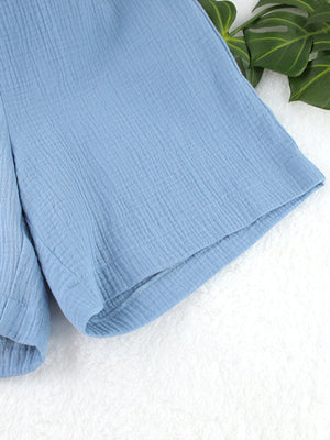 Light blue textured cotton bermuda shorts with a casual, breathable cut.