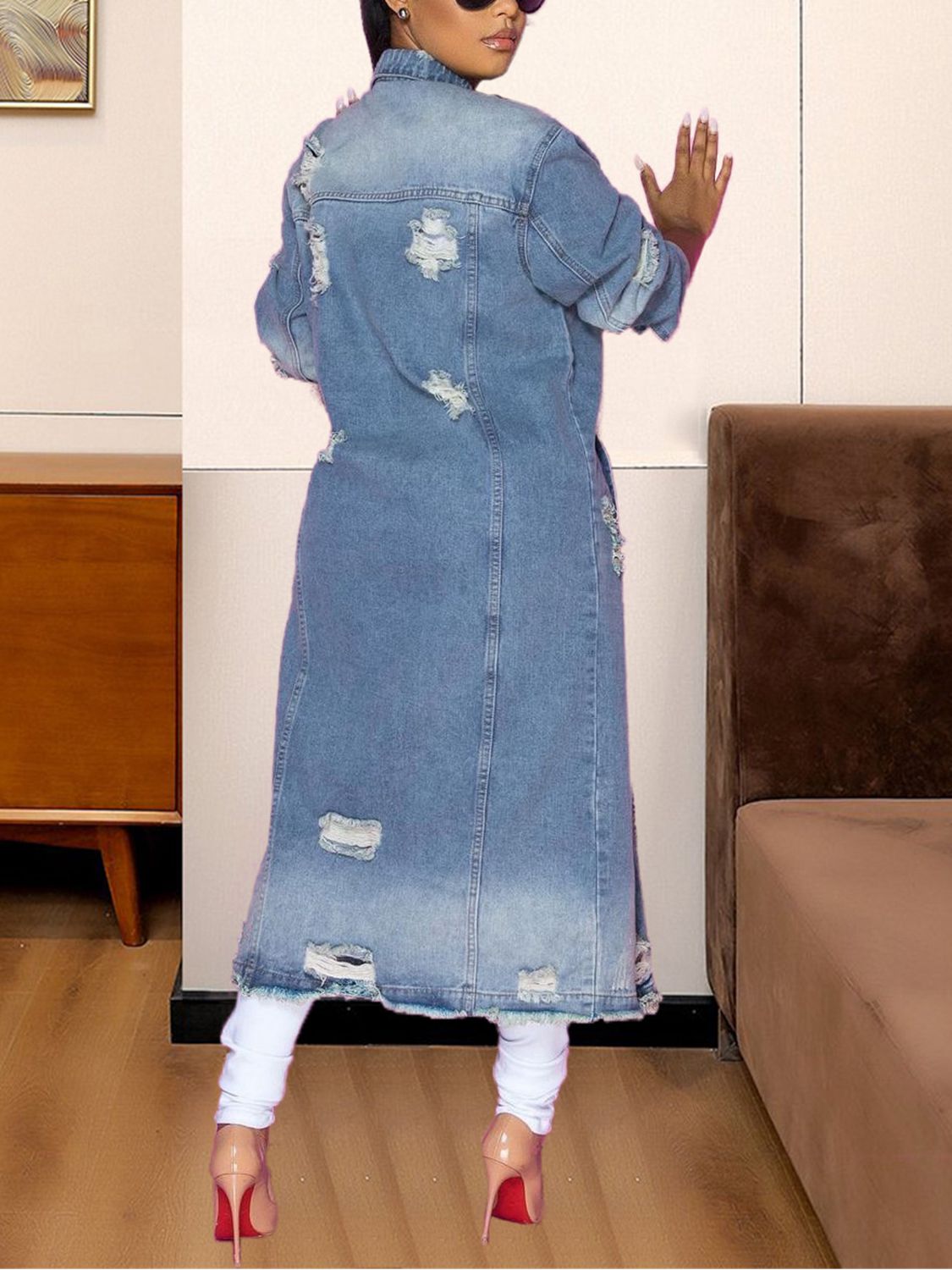 Light wash distressed denim duster coat with a long length and casual cut.