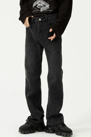 Black denim straight leg jeans with panel seam detailing and a casual fit.