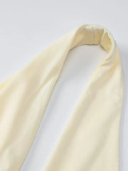 Yellow halter neck maxi dress detail showing ruched fabric.