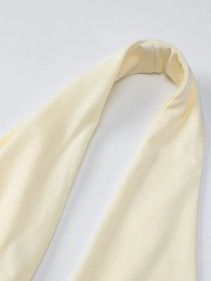 Yellow halter neck maxi dress detail showing ruched fabric.