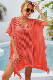 Orange open-knit beach cover-up with V-neck and fringe details.