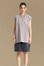 Washed cotton muscle tee in gray, relaxed fit, sleeveless with raw hem.