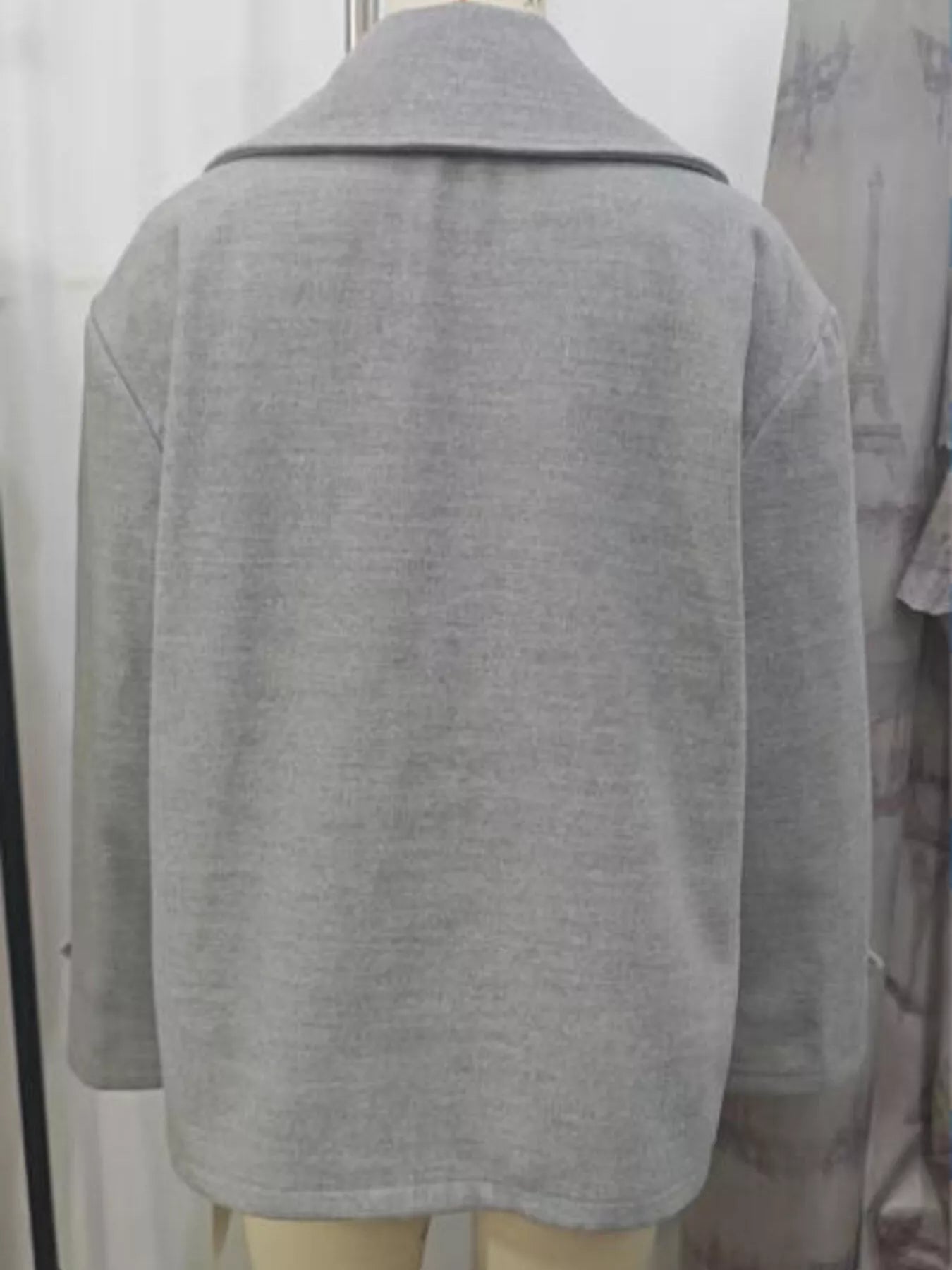 Light gray double-breasted wool blend pea coat with a wide collar.