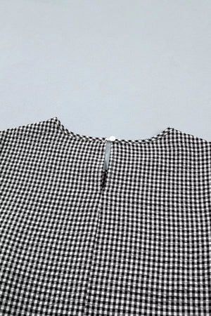 Gingham shirt with ruffled sleeves and bow tie neck detail.