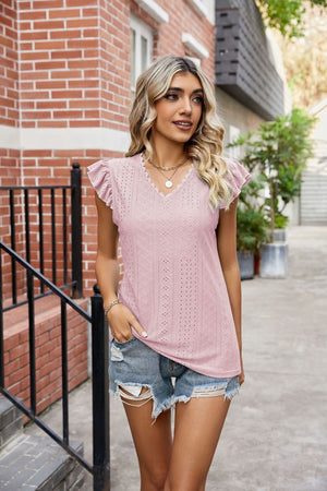 Blush pink eyelet blouse with lace trim and flutter sleeves.
