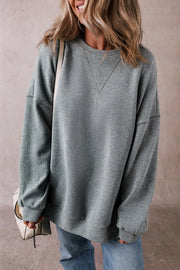 Relaxed fit ribbed sweatshirt in dark gray with crew neck and V-stitch detail.