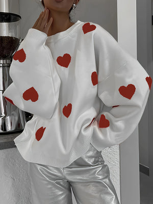 White oversized knit crewneck sweater with red hearts and drop sleeves