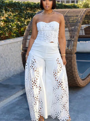 White lace cutout tube top and wide-leg pants set with intricate detailing.