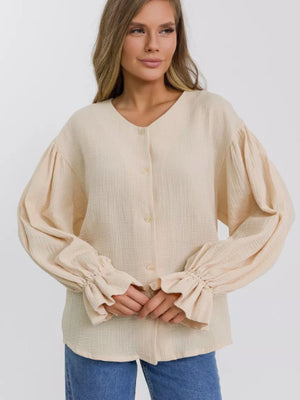 Ochre textured puff sleeve blouse with ruffled cuffs and V-neck