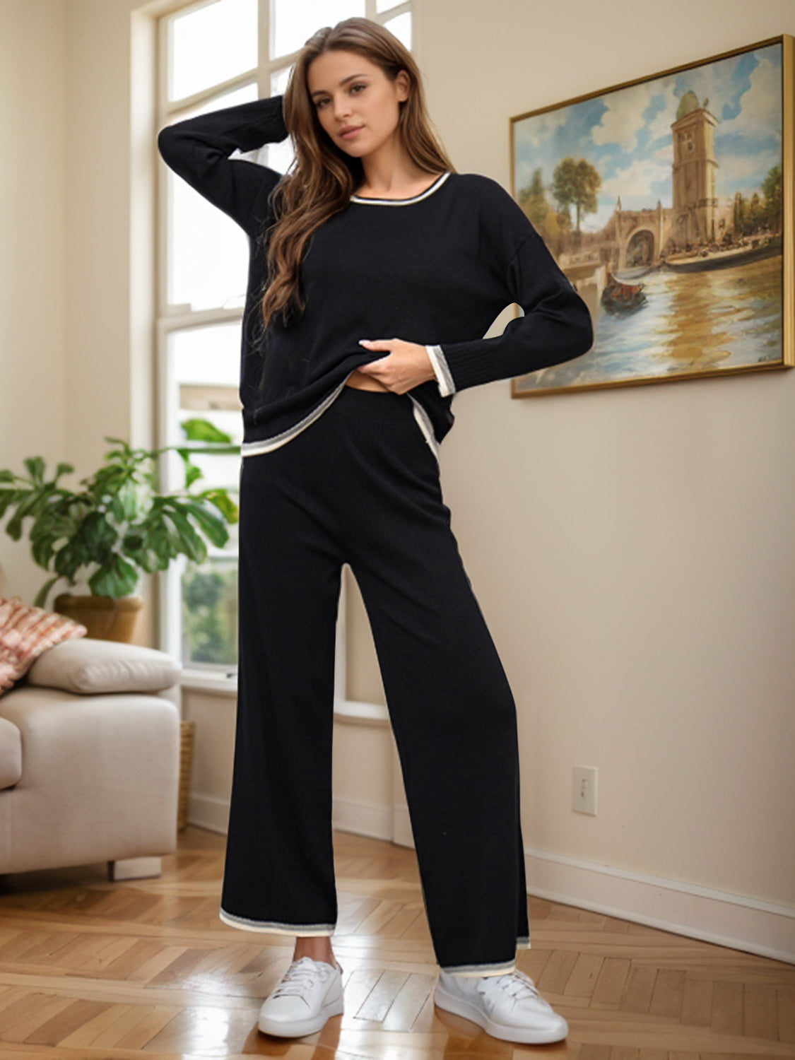 Black acrylic sweater set with contrast trim, crew neck, long sleeves, and wide-leg pants.
