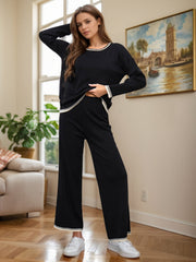 Black acrylic sweater set with contrast trim, crew neck, long sleeves, and wide-leg pants.