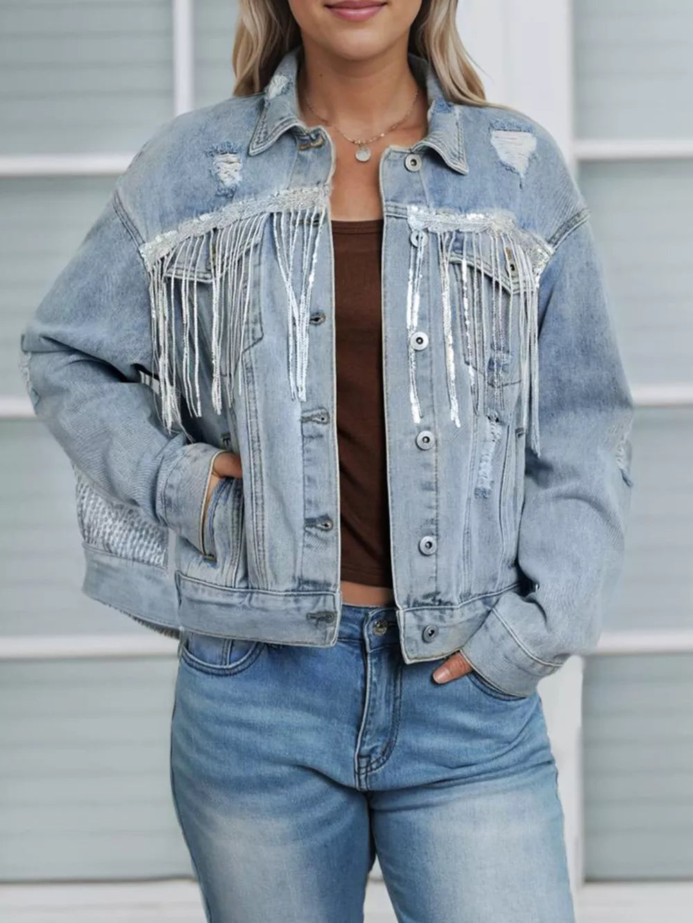 Light wash denim jacket with sequin fringe and distressed details