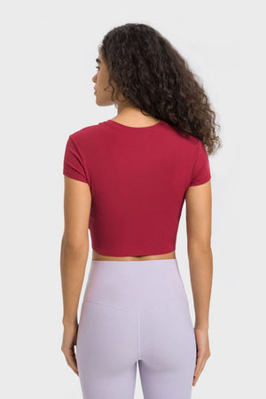 Red ribbed crewneck crop top with short sleeves.