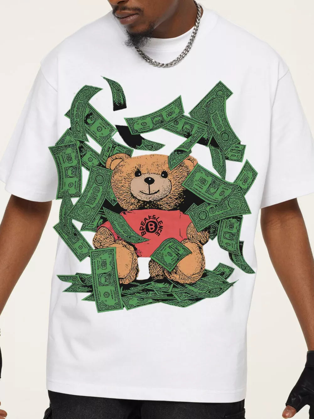 White cotton blend t-shirt with teddy bear graphic and falling money.