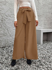 Belted palazzo trousers in caramel polyester with a fluid drape and tie waist.