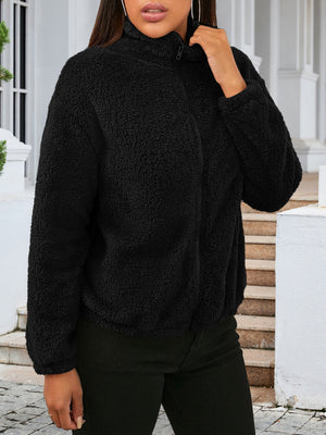 Black sherpa bomber jacket with zip front and mock neck.