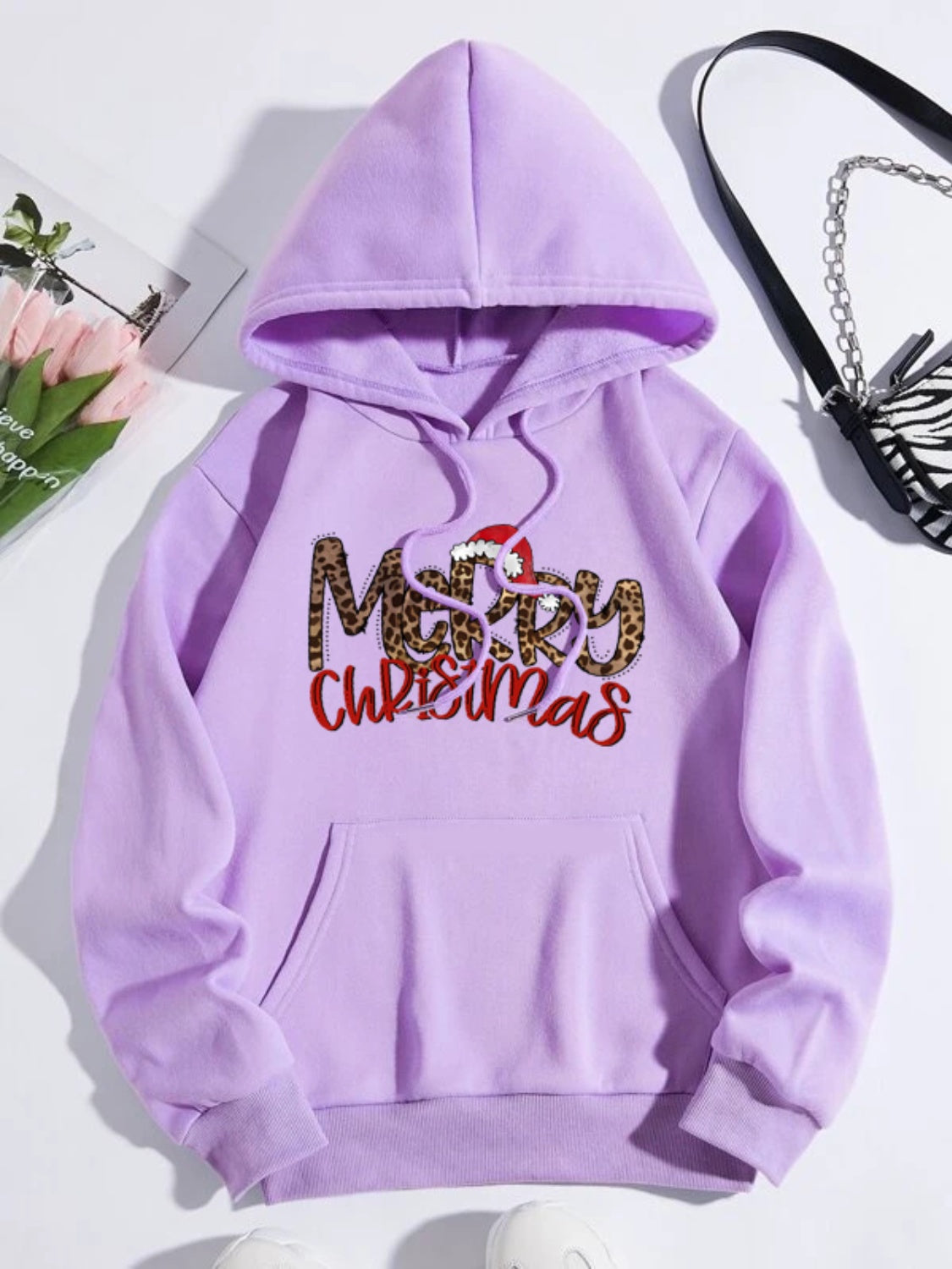Lavender hoodie with adjustable hood and Merry Christmas leopard print graphic.