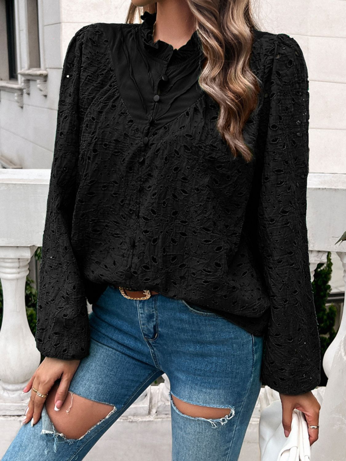 Black eyelet embroidered blouse with ruffle collar and button front.