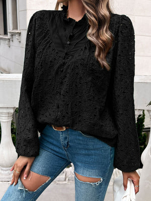 Black eyelet embroidered blouse with ruffle collar and button front.