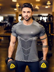 Men's dark gray performance mesh sculpt tee with geometric pattern detail.