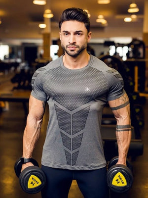 Men's dark gray performance mesh sculpt tee with geometric pattern detail.