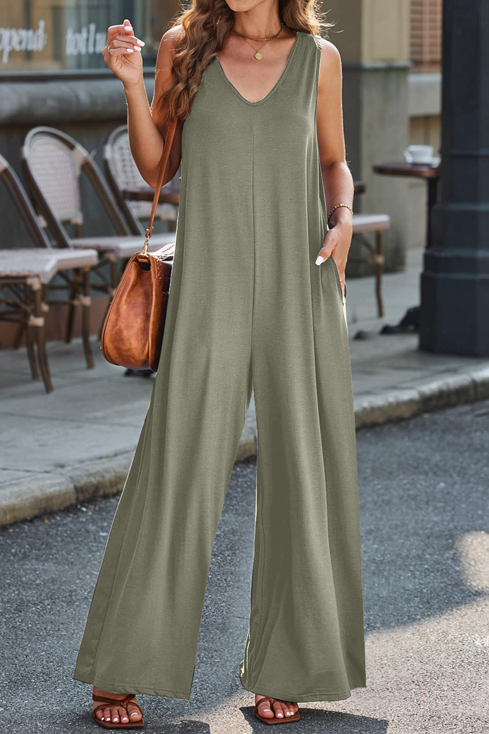 Flowing palazzo jumpsuit in Matcha Green with V-neck and wide legs.